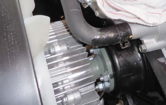 If you have an air injection system remove the bolt shown with