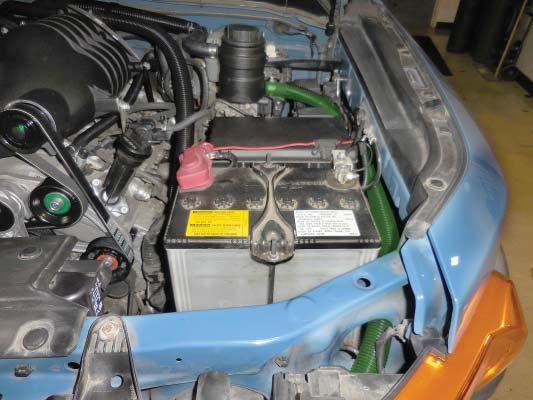 Here you can see the routing for the hose from the coolant pump inlet to the reservoir tank