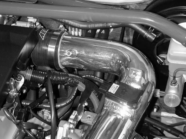d) Slide coupler attached to the upper intake pipe over the throttle body using the