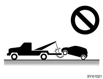 04 05.18 (c) Towing with sliding type truck SY41021 (c) Towing with sling type truck NOTICE Do not tow with sling type truck, either from the front or rear. This may cause body damage.