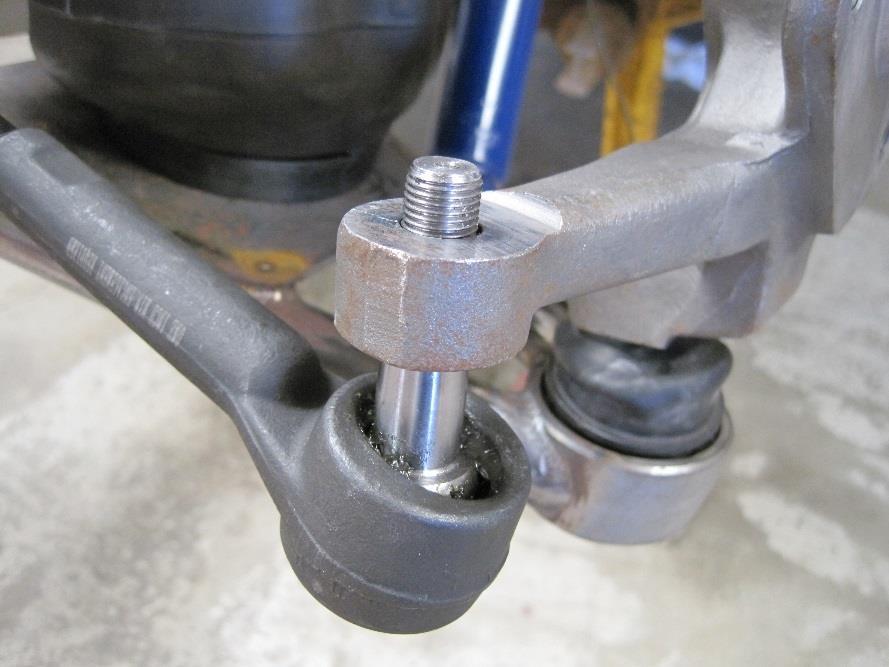 STEP 4 Start by holding the Spindles as close to straight as possible. Thread the Outer tie Rod End IN or OUT until it lines up with the Spindle Steering Arm.