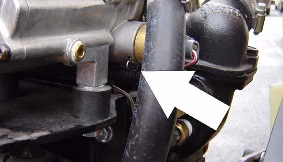 Remove the retainer clip for the LPG fuel temperature sensor and remove the sensor from the regulator body.