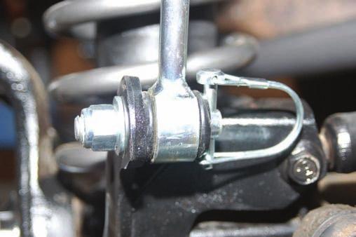 Remove the stock brake line from metal line at frame rail using a T40 torx bit and also on caliper. Retain stock hardware to reinstall the brake line. A catch pan is recommended to contain fluid.