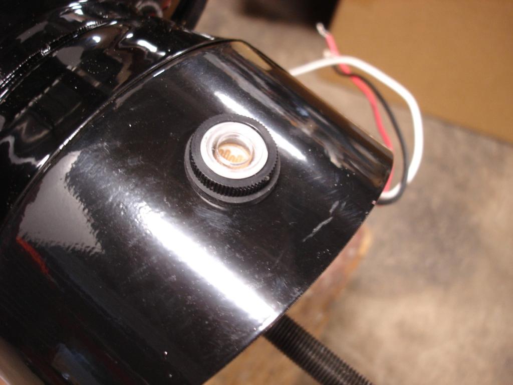 Insert the light sensor into the globe adapter so that the wires extend sideways 4.