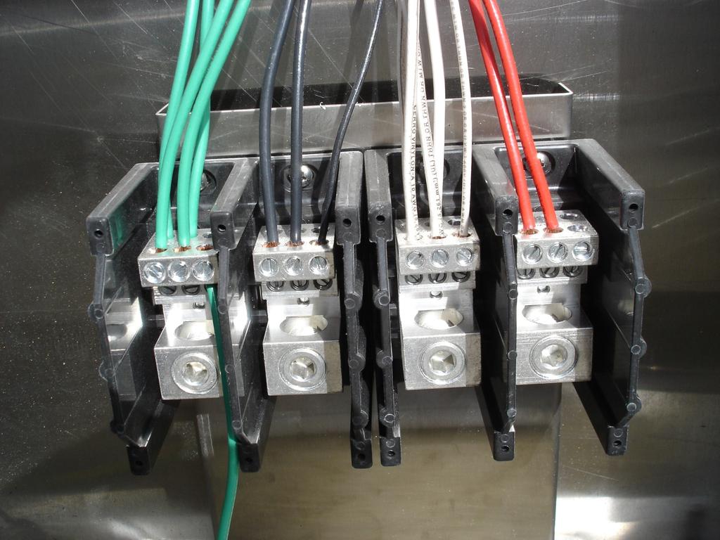 4. Attach incoming line power to distribution blocks. Feed power lines through base Plate into distribution blocks.