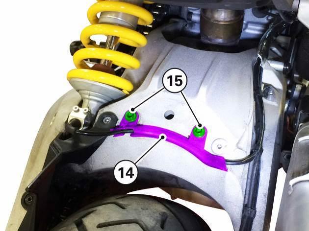 11) Remove the swing-arm cable guide (14) by unscrewing the 2 screws M5x10.