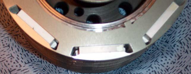 ways (not shown) on the rotor hub. After inserting the PMs, the top-clamping piece is then inserted on the rotor core.