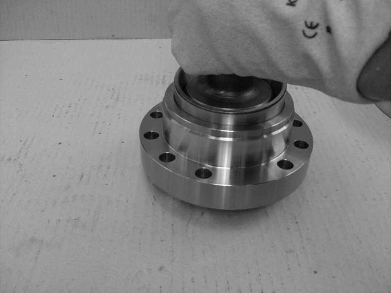4.7.2. ASSEMBLY 1 Drive the cup of the tapered roller bearing (4) into the pinion housing (5) with the special tool (T15).