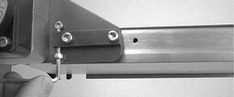 Timing Belt Tensioning A WARNING Preventive Maintenance and Adjustment 4. Remove old timing belt (Figure 54, item ). Figure 54. Loosen two () screws (Figure 5, item ).