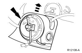 8. NOTE: The air bag sliding contact (14A664) has a service lock that prevents accidental rotation when the steering wheel is