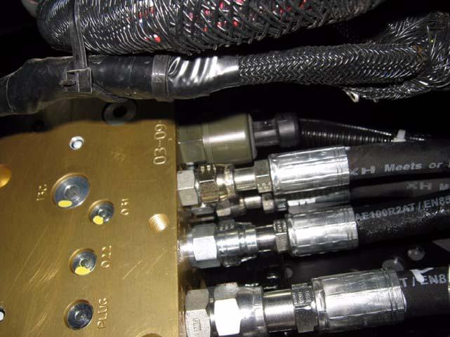 Connecting Hoses to the Steering Valve 8. Tighten all the hydraulic hose end fittings. See Figure 2-23. Figure 2-23 Hose End Fittings 9.
