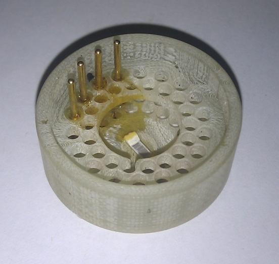 96 within a cap which plugs into the telemetry unit. Figure 4-28 shows one of the telemetry caps with a PRT bonded into the unit.