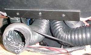 Route over the face duct and attach to the hose adaptors as shown.