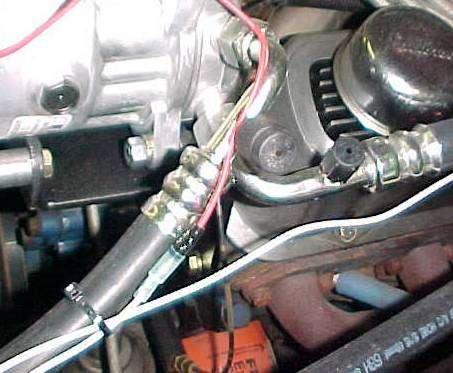 VEHICLES WITH V8 ENGINES: Attach the disharge hose assembly to condenser and then to compressor.