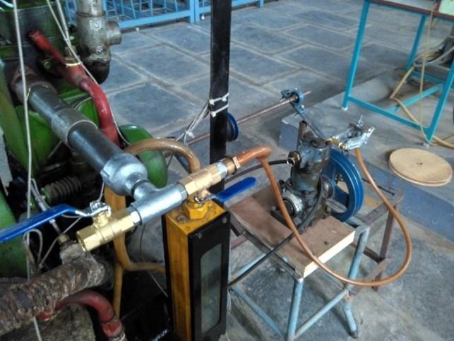 into a compressed air engine by removing delivery valves, closing suction valve and we made two external valves by using two air guns of a size of quarter inch diameter and we also changed the pulley