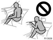 Do not sit on the edge of the seat or lean over the dashboard when the vehicle is in use.