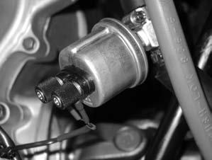 The thermal switch is located toward the top of the engine near the coolant outlet.