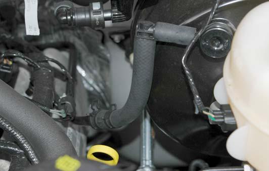 On 2005-2006 4WD vehicles remove the brake vacuum line where it meets the