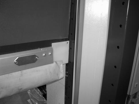 INSTALLATION PHOTO EYES Breakaway Tabs Door Panel Has Been Reset and Is Shown in Normal Operating Position Side Column Channel A8600018 Figure 31 2.