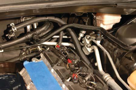 Use the provided split loom and zip ties to protect the driver side heater hose from any potential chaffi ng points (as you did