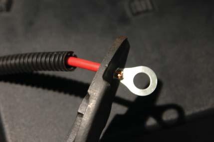 Cut the existing eye terminal from the end of the red wire and replace with the larger supplied eye