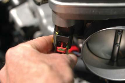 141. Connect the throttle body plug to the throttle body connection.