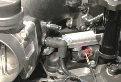 157. Plug the EVAP plastic tube on the driver side of the engine into the barb below the bypass hose on the