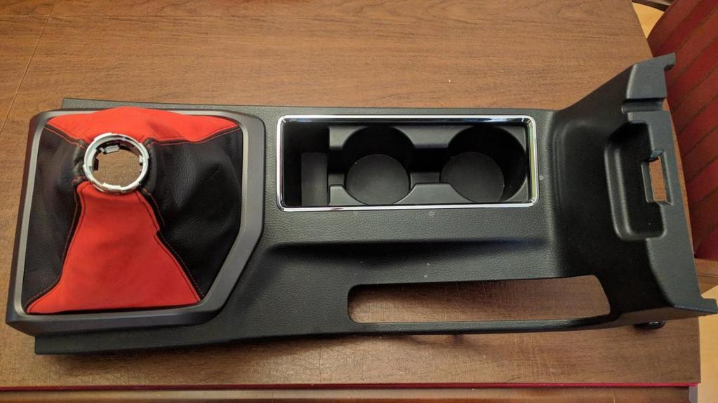 Check that all 12 red trim clips of the center console cover are
