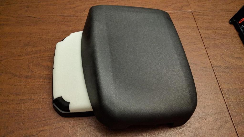 Install the new cover onto the armrest. The new cover needs to be glued. There are several kinds of glue that can be used, the 3M used below is just one of them.
