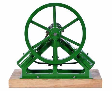 balanced crank, steam control valve and flywheel 4.5cm diameter, finished in green paintwork, mounted on hardwood plinth measuring 14cm x 8cm, overall 17cm high.
