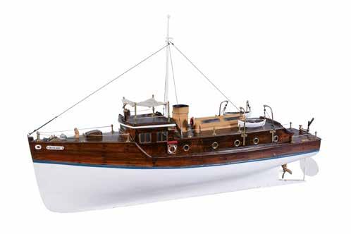 128 An early model of a steam boat, of wooden construction with simulated plank decking