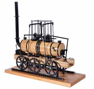 The model finished in black paintwork and mounted on varnished wooden plinth 51cm x 9.5cm. The engine supported on four columns. Locomotive measures 45cm x 6.5cm. Height to top of chimney 48cm.