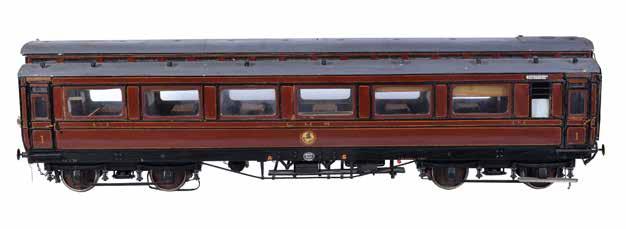 44 A rare model of a 19th century 4 ¾ inch gauge railway coach, with original fitted interior having individual seats with arm-rests.