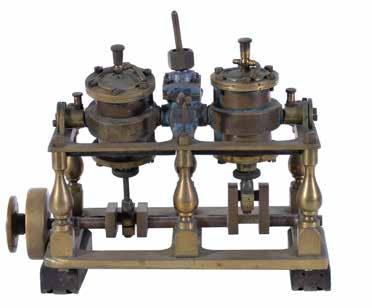 89 A late 19th Century model marine twin cylinder vertical oscillating screw engine, the cylinders 1 inch bore by 1 ¼ inch stroke with cylinder head lubricators, reversing valve chest