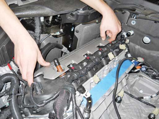 Install the coil on plug bolts and torque to 6