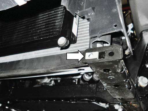 Secure each bracket at the radiator using a Bolt (W705128) and Nut (W520413).