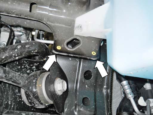 NOTE: The bracket is placed on the outside of the frame behind the wiper pump reservoir
