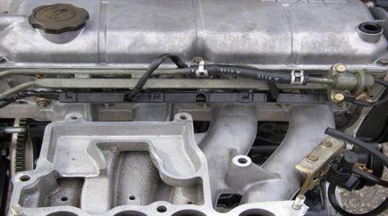 The fuel rail and injectors regulate the amount of fuel via the EMC (engine management