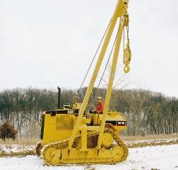 Pipelayer Caterpillar pipelayer system includes winch and boom, counterweight and frame. Winch and Boom Boom and hook drawworks are driven by independent hydraulic winches.