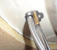 Ensure sealing washer is positioned flat between basin/sink and tap body base.