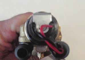 The solenoid and sensor connectors are to be secured within the gray plastic connector housing which is fixed to the solenoid.