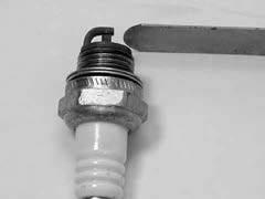 6. SPARK PLUG 680GC SERVICE MANUAL 6.4 Gap if necessary to 0.02" (0.5mm).