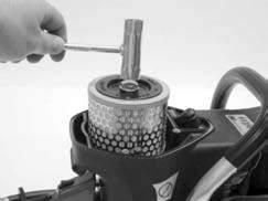 Guide carburetor compensating tube through air filter mount. Make sure manifold sits flat over lip on cylinder cover. B.