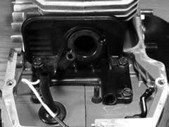 Slip rear manifold into and through carburetor base. C. Make sure rear manifold lip is flat. 13.