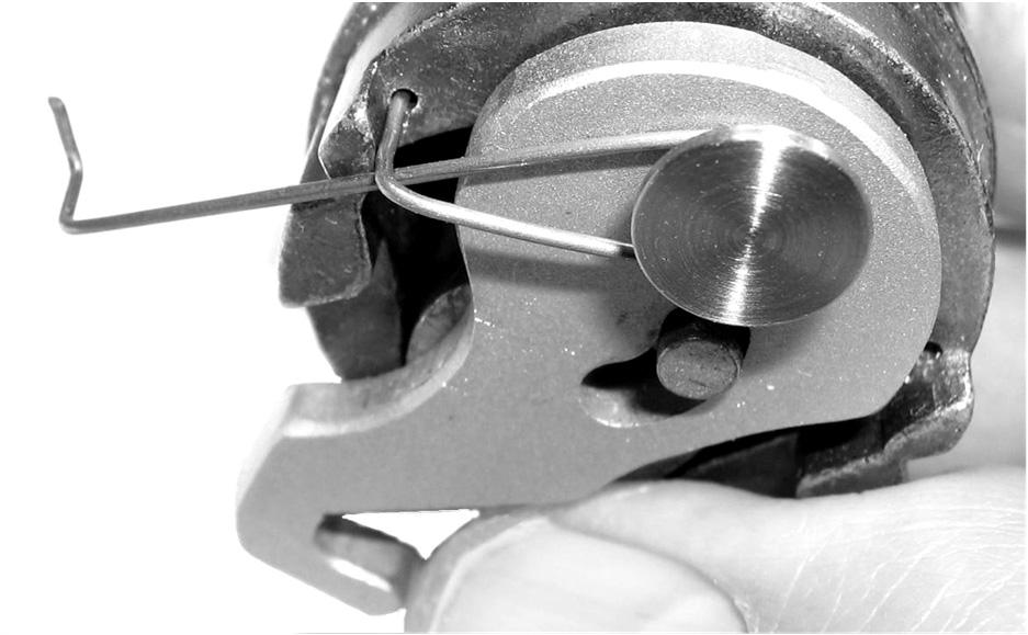 Fig. 2g: Insert pin and spring; pull arm and clip on hook cam lever. pin 3a.