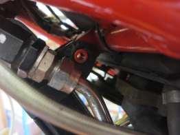 the oil cooler guard frame, so that they sit between the oil cooler guard and