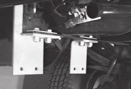 Disconnect trailer wire harness (if equipped) at gray connector. 3. Support bumper and remove nuts securing bumper brackets to frame. (Two per side.) Rear Bracket Installation 1.