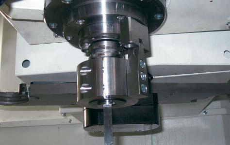 axis. The machine is capable of 5 axis simultaneous control to machine multiple surfaces in a single