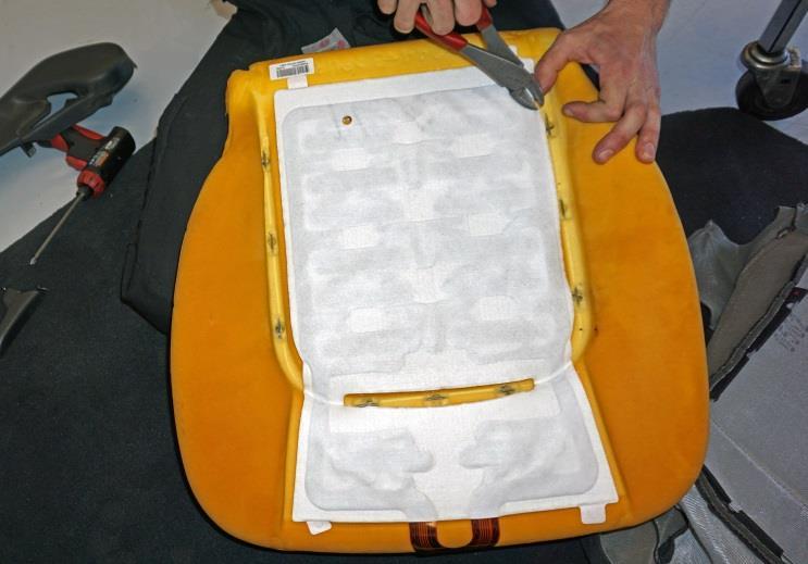 Remove the seat cover from the lower cushion and inspect each of the nine (9) seat cover attachment