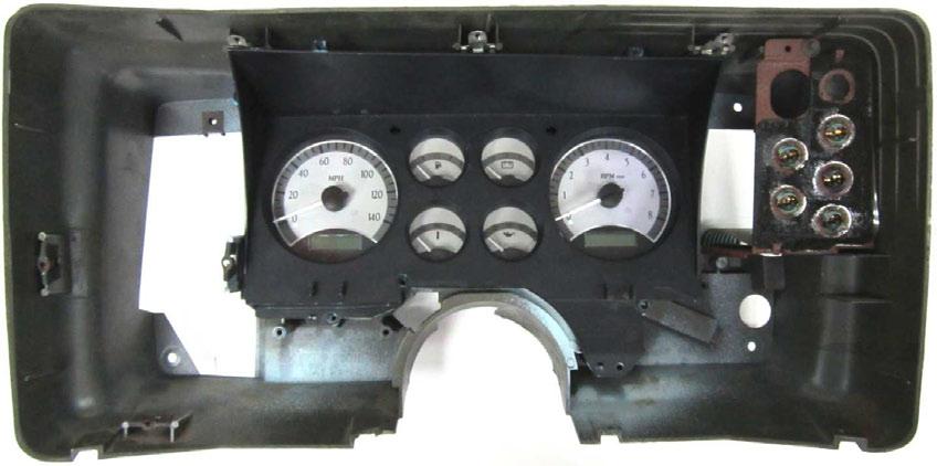 7. Separate the stock lens from the blackout plate; the original lens is not needed. Place the blackout plate over the Dakota Digital gauges while aligning the mounting holes.